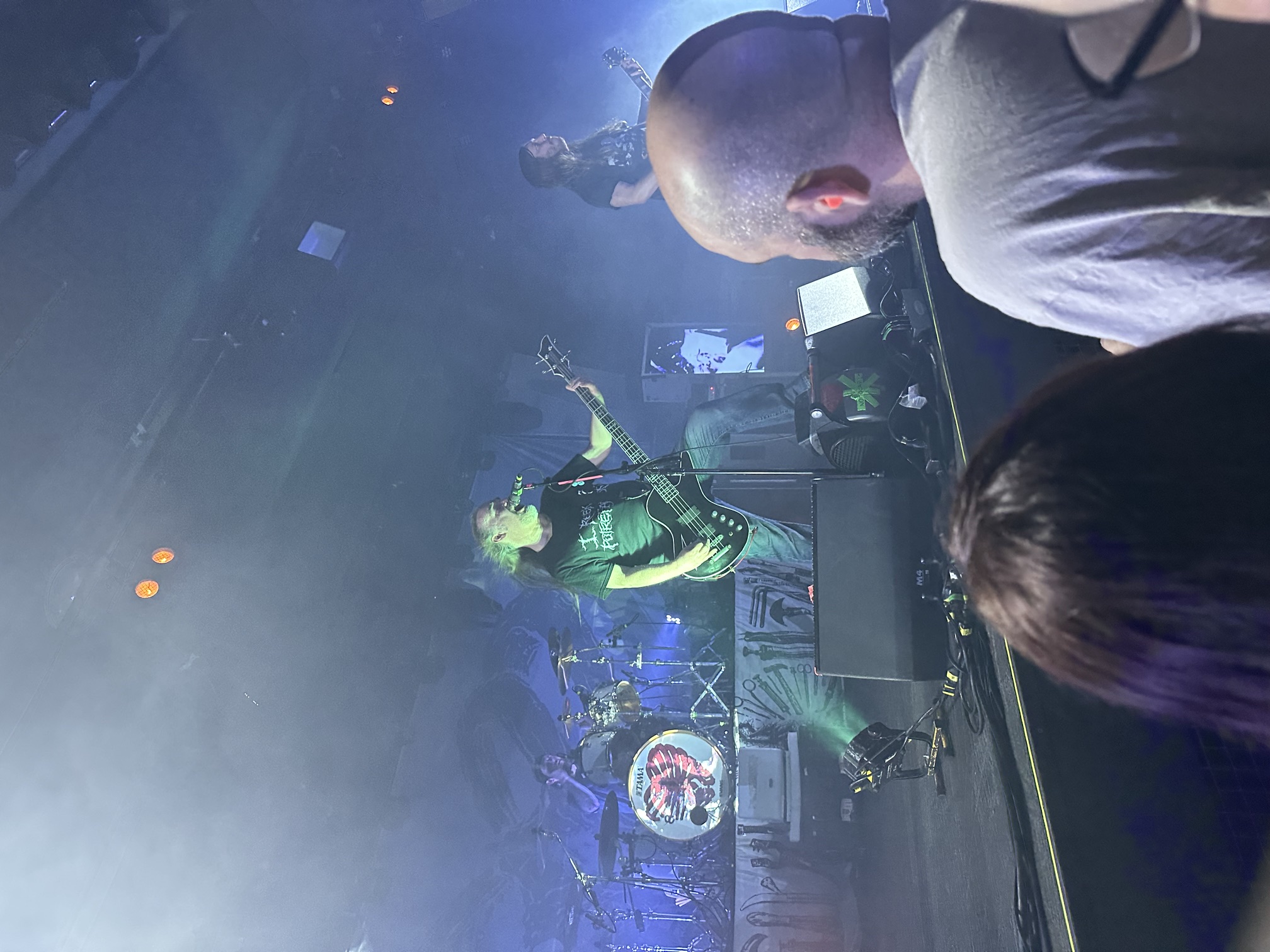 Live show, band under blue and green stage light