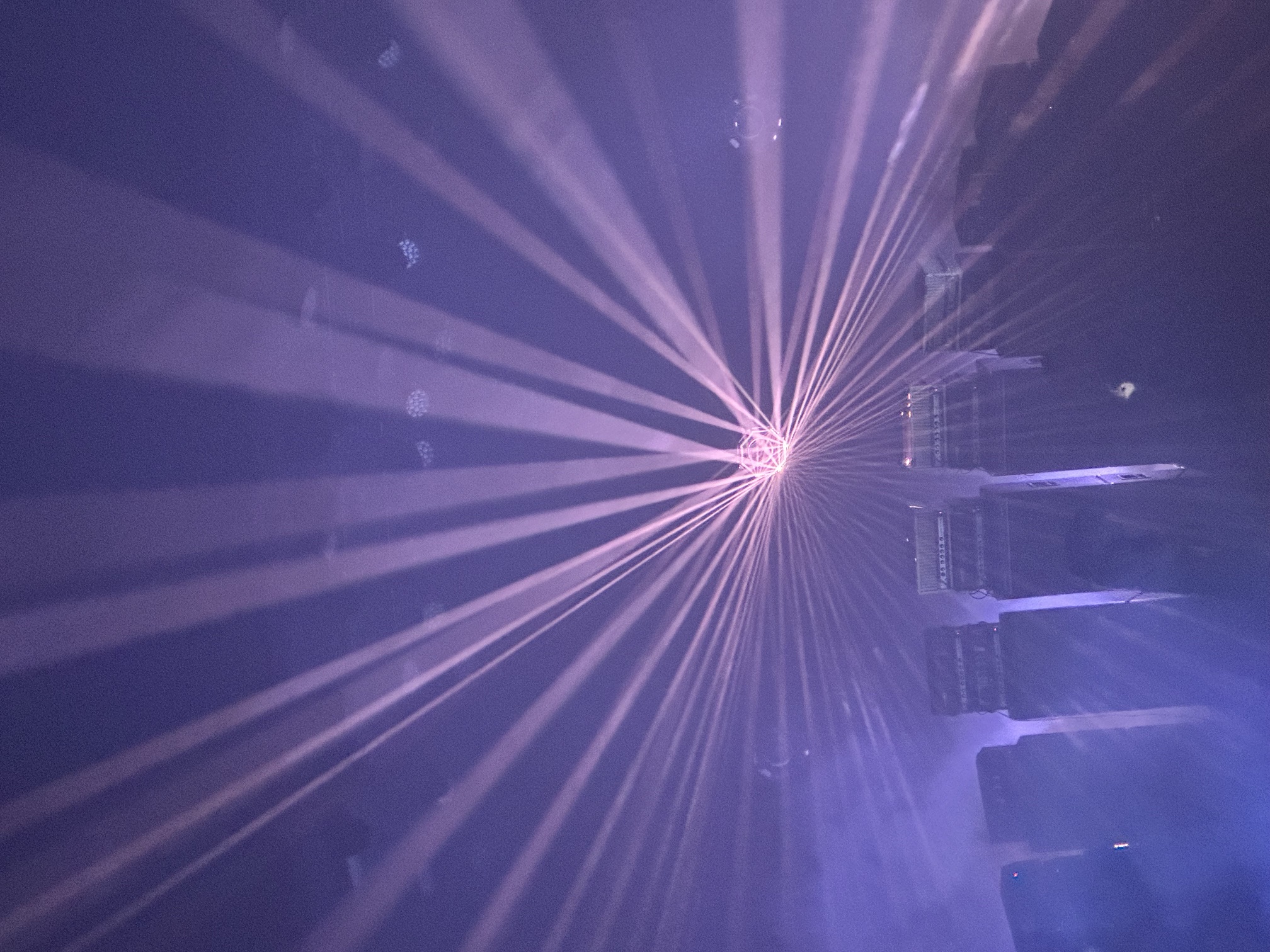 Live show, purple laser starburst over the stage